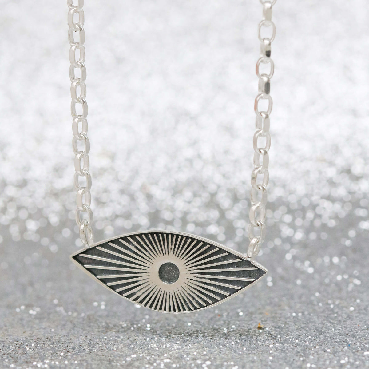 Silver and Black Necklace with Sunburst Motif